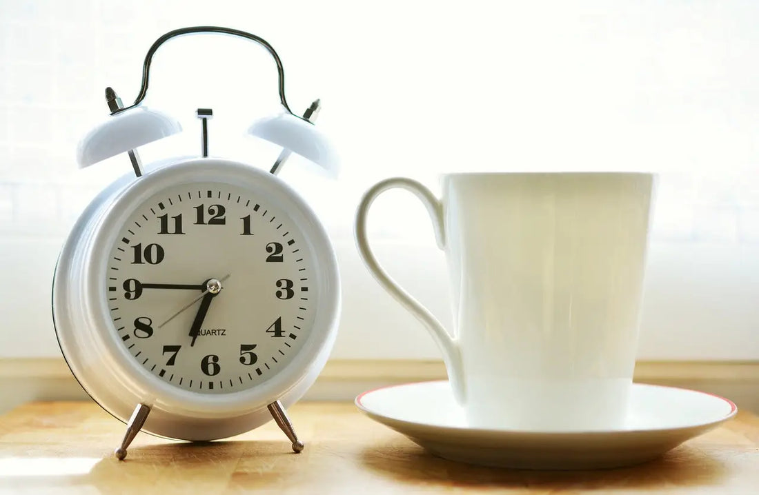 White alarm clock symbolizing time management and benefits of Intermittent Fasting for weight loss