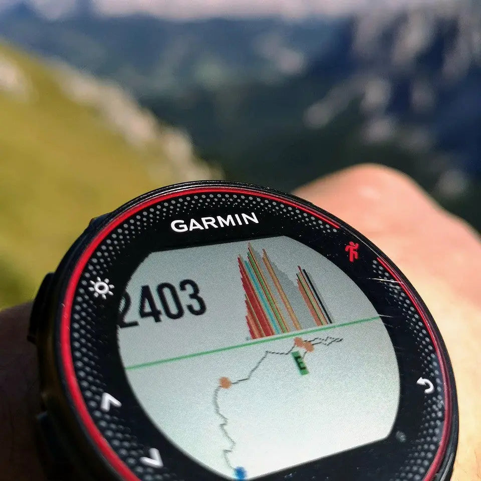 Garmin Forerunner smartwatch displaying elevation data in a fitness tracking comparison