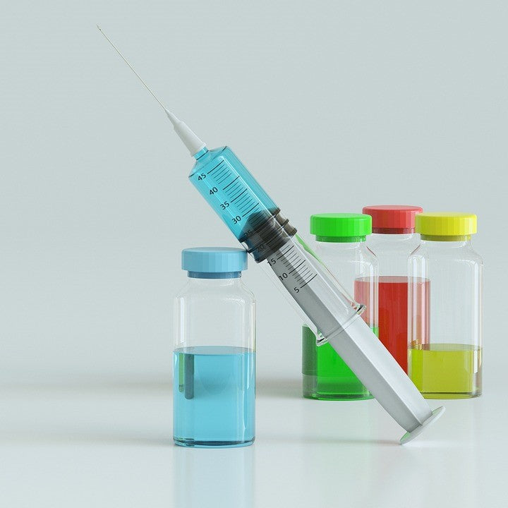 Syringe with colorful vials representing weight loss injections and potential benefits