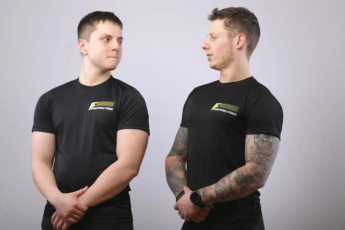 Two men in black T-shirts demonstrating self confidence for building and maintaining self assurance