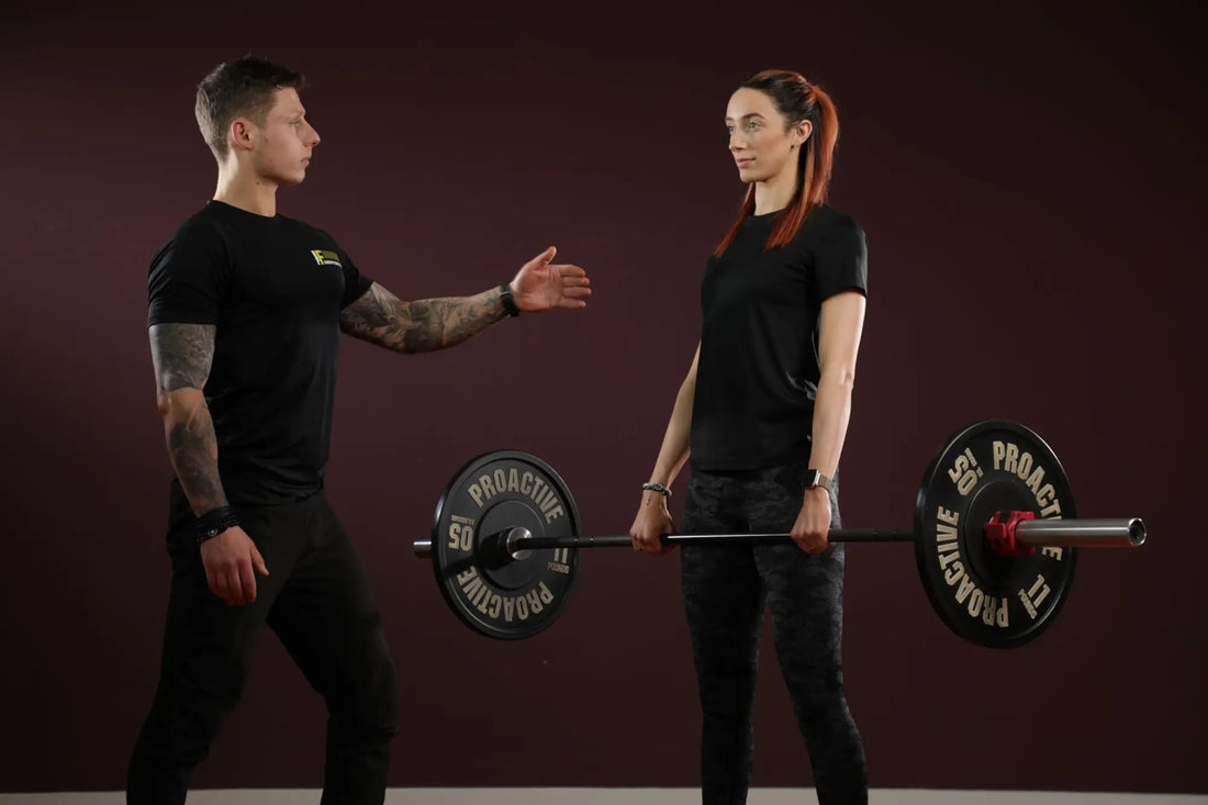 Barbell with weight plates for German Volume Training intense workout for muscle size