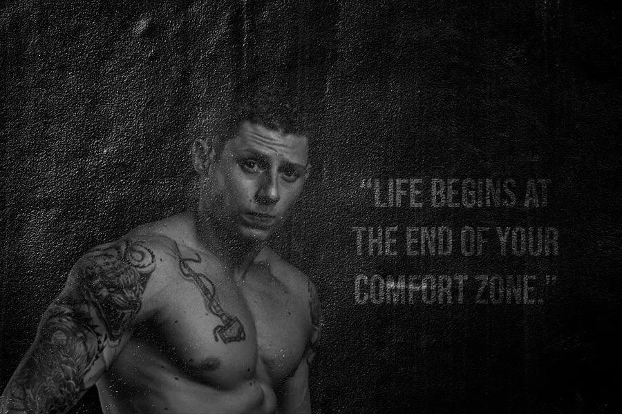Tattooed man with motivational quote for new week new challenges and cold showers
