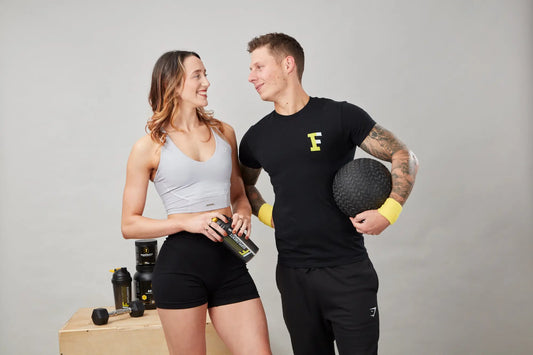 Athletic couple with workout gear promoting overcoming gym anxiety and practicing deep breathing