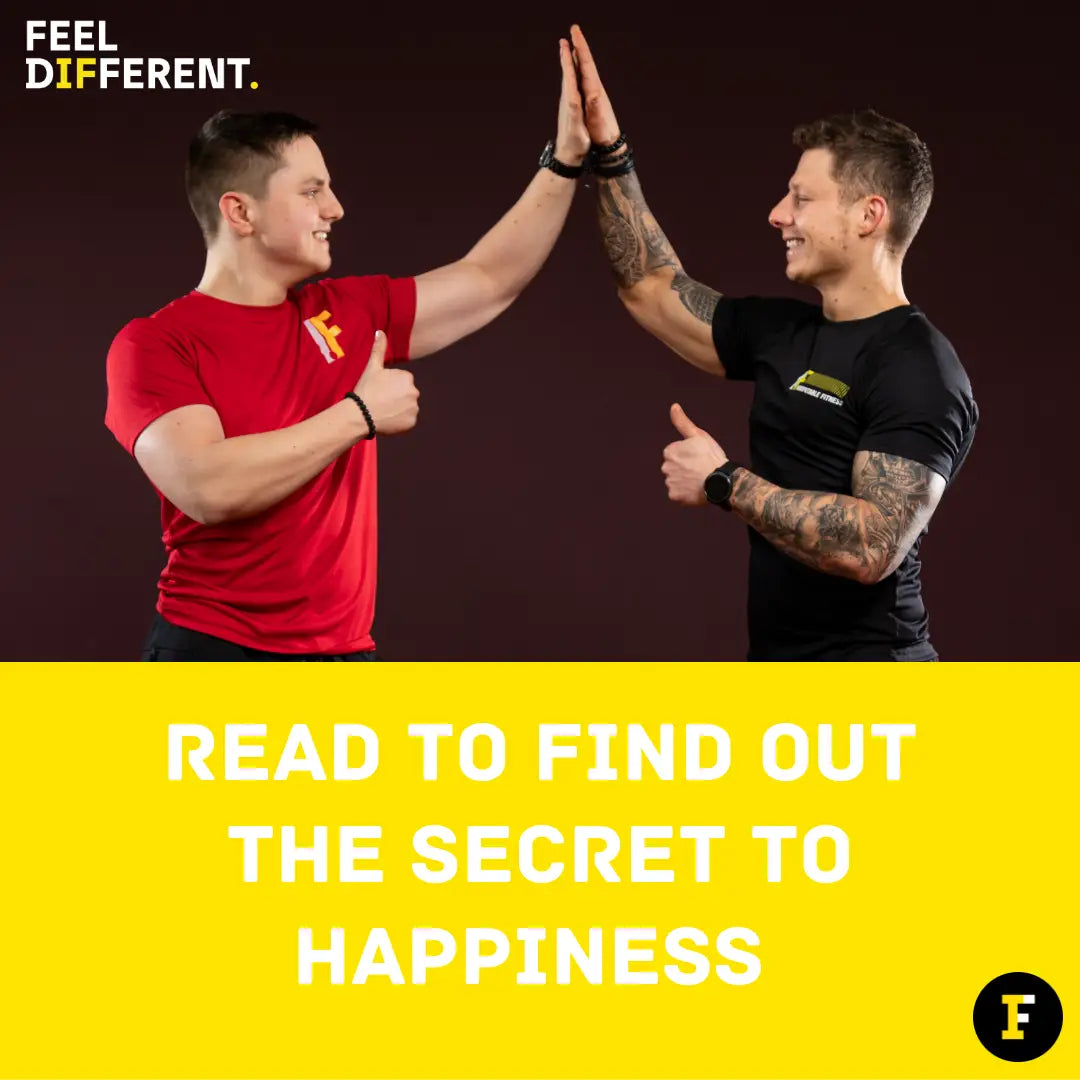 Two muscular men high-fiving, showcasing the benefits of regular exercise for feelings of happiness