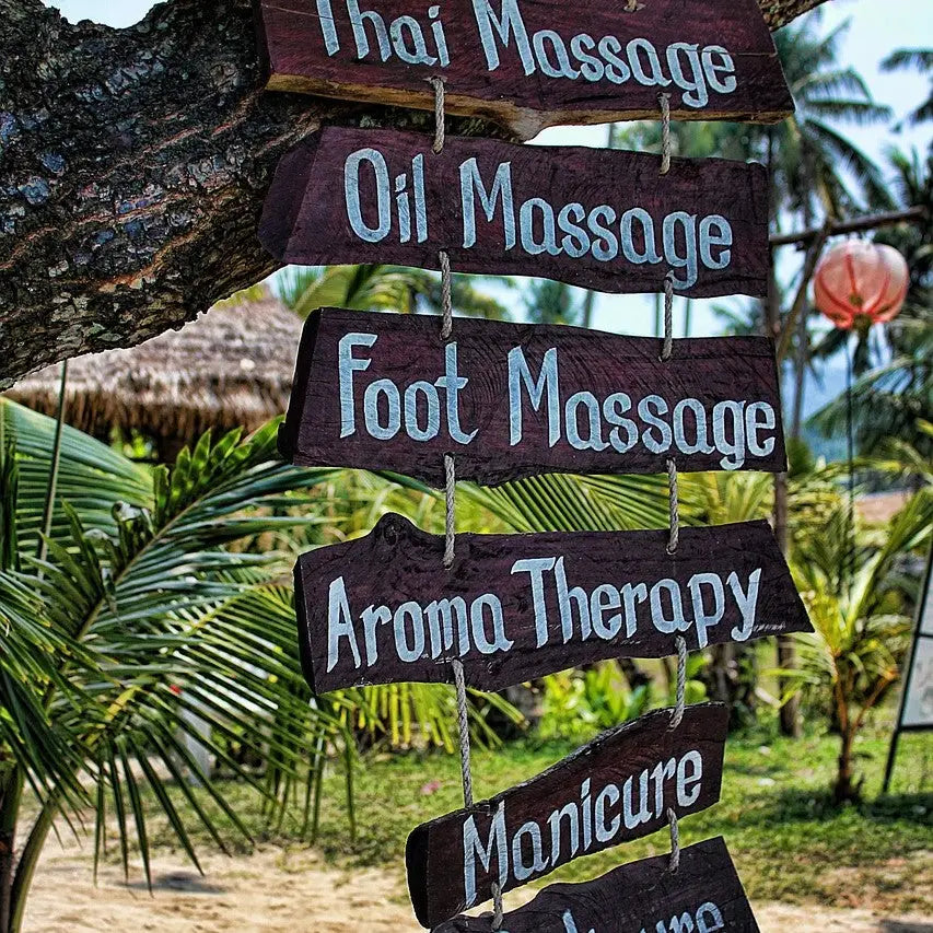 Wooden signs for sport massage services highlighting sports injuries and sport massage therapists