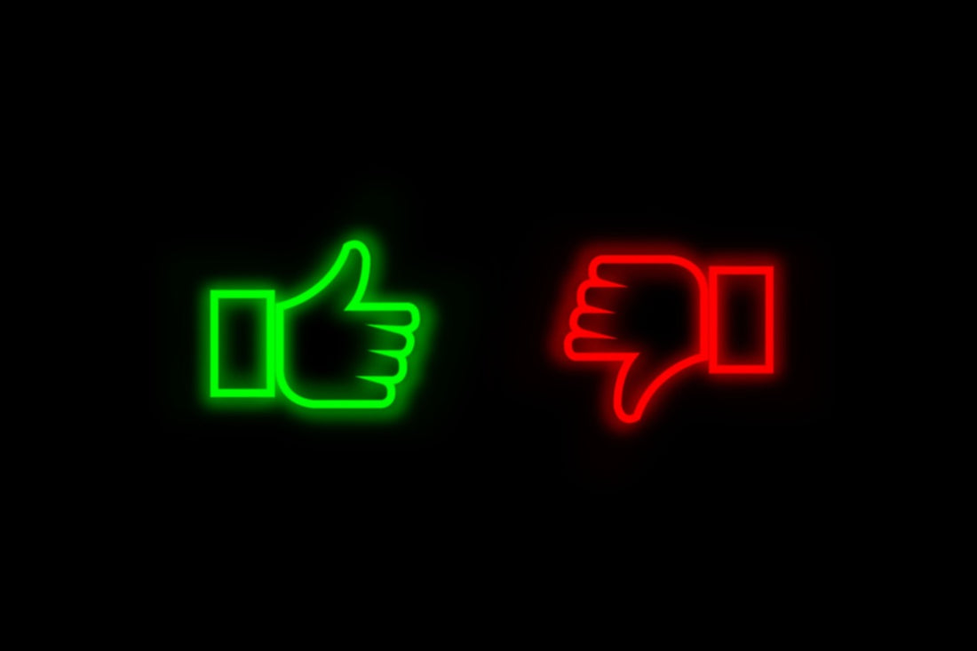 Neon thumbs up and down icons symbolizing fitness goals progress and decisions