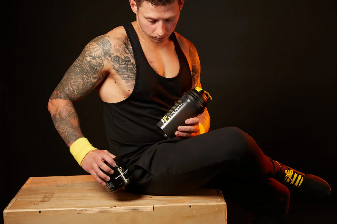 Muscular man with protein shake showcasing recovery process for fitness journey after intense workouts