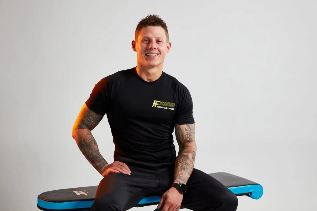 Man in black athletic wear demonstrating the balance of testosterone and estrogen