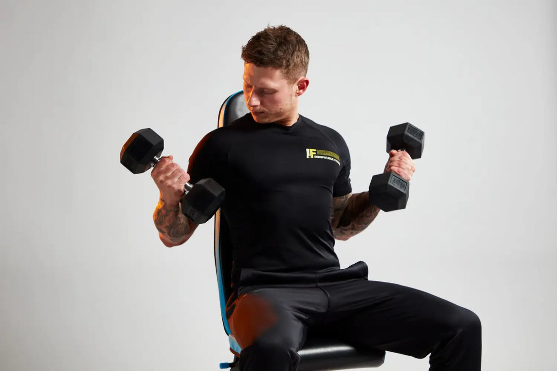 Man lifting dumbbells on weight bench to boost physical activity and achieve weekly exercise goals