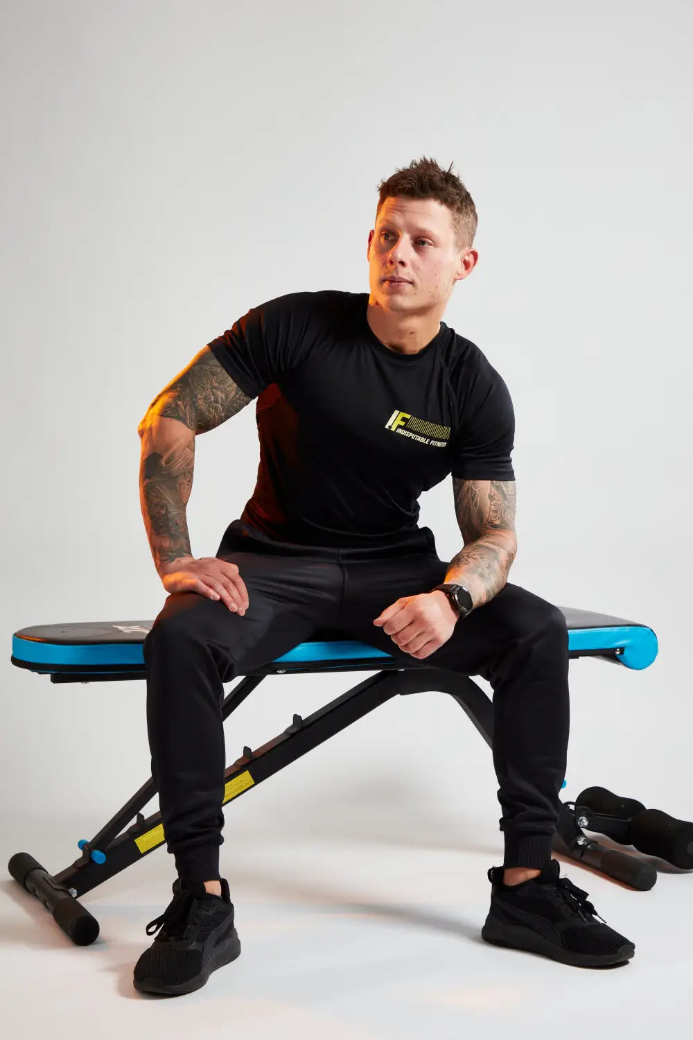 Man sitting on workout bench symbolizing overcoming imposter syndrome in your career