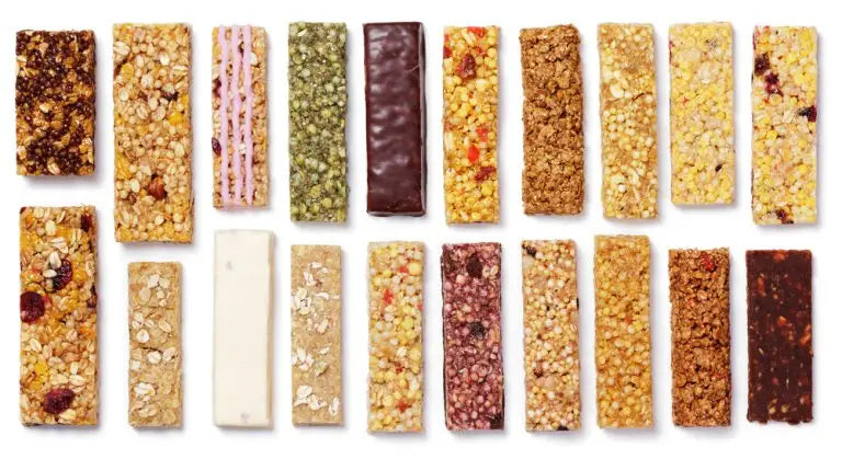 Assorted protein rich snacks featuring granola bars for healthy eating in the UK